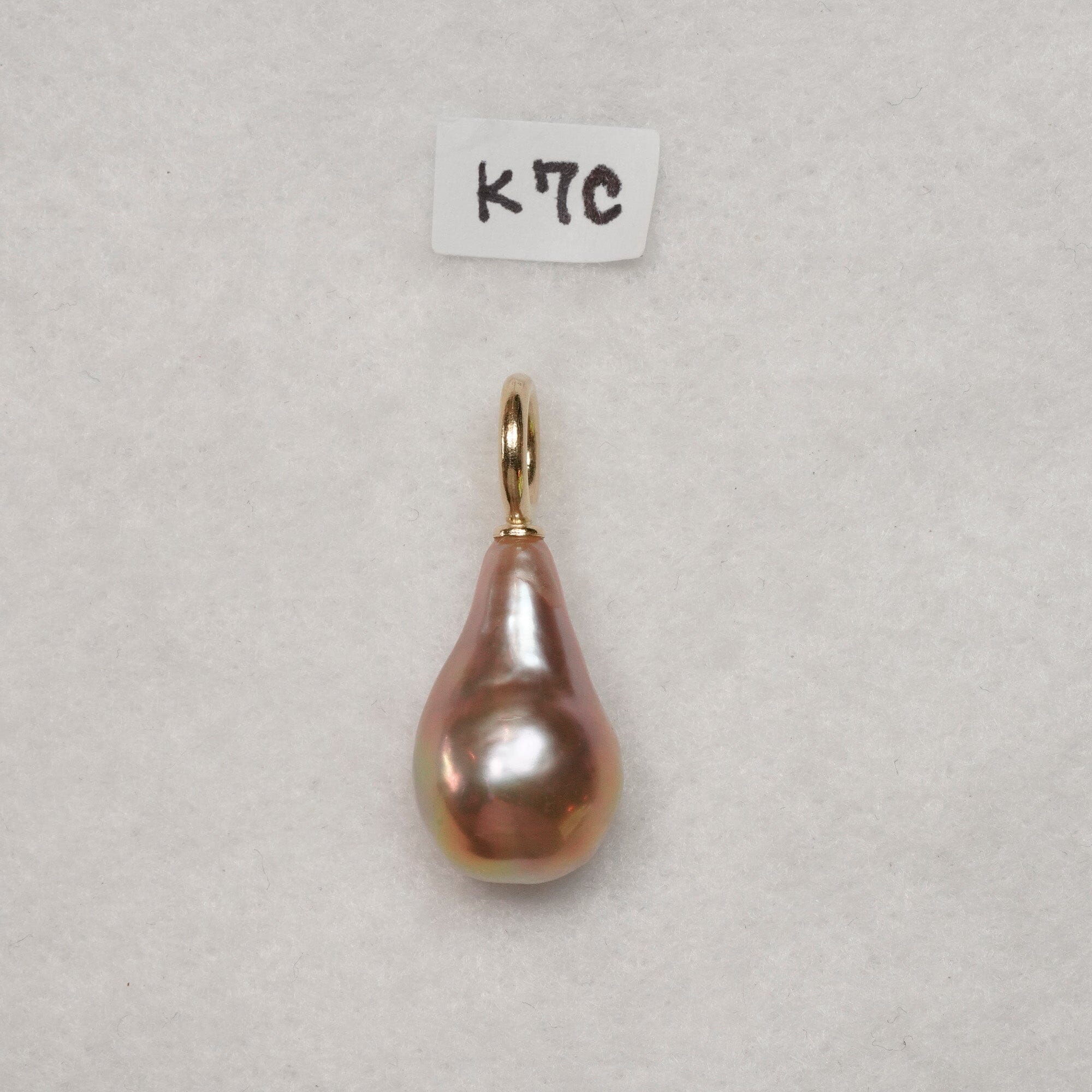 K7: 11 x 20 mm light pink pear shaped pearl on 14k