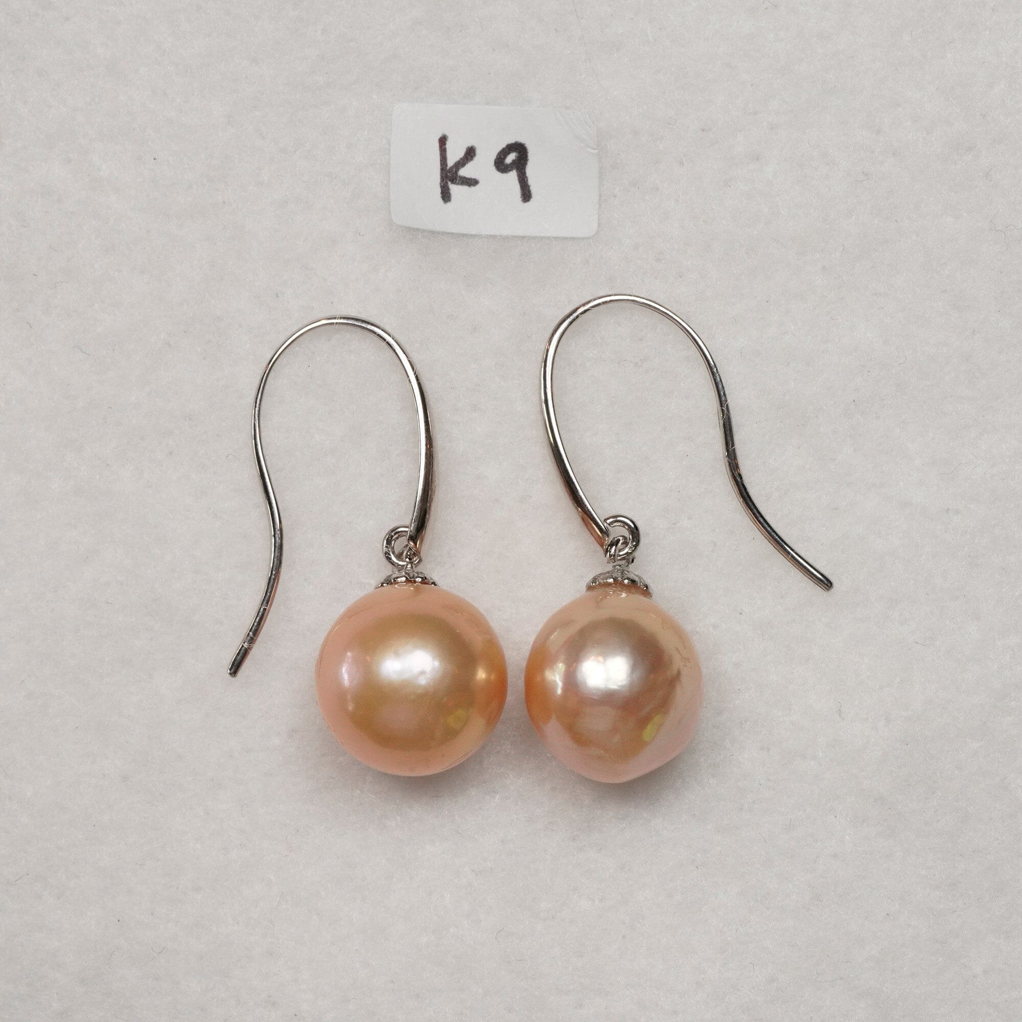 K9: 11.5-12 mm peach near round on 14k