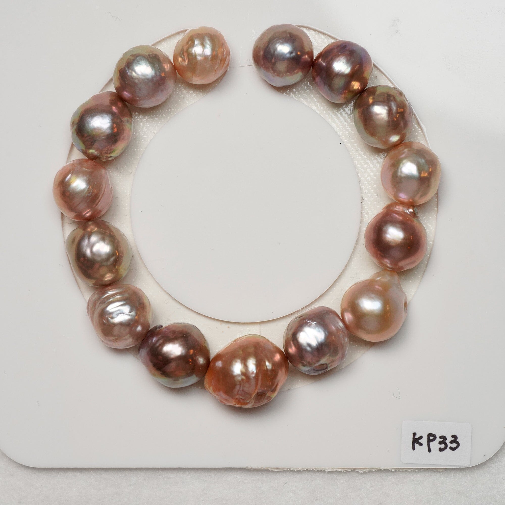 KP33: 10.8 x 13.1 mm brassy pink peach high luster bracelet