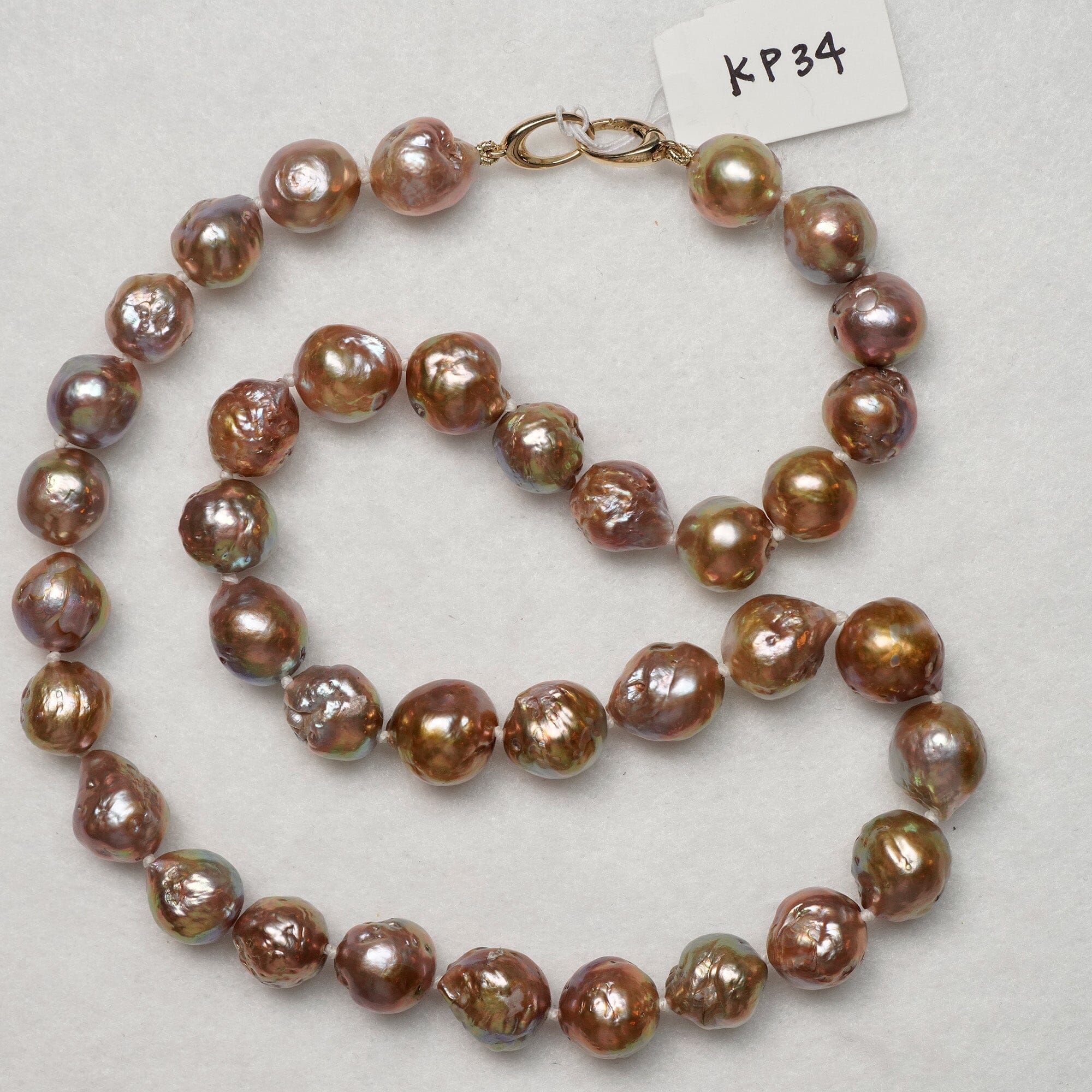 KP34: 9.5-11.5 mm tiny golden rainbow baroques on 14K yellow gold clasp 18"